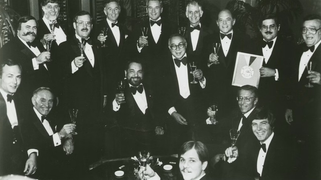 Early Restaurant Award winners in black tie, raising a toast